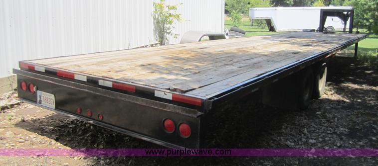 image for item A4797 2006 Progressive flatbed goose neck trailer
