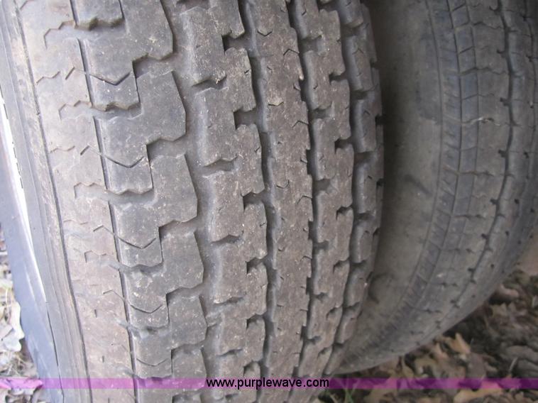 image for item A4797 2006 Progressive flatbed goose neck trailer