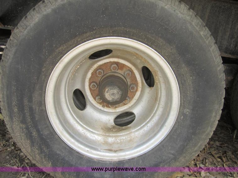 image for item A4797 2006 Progressive flatbed goose neck trailer