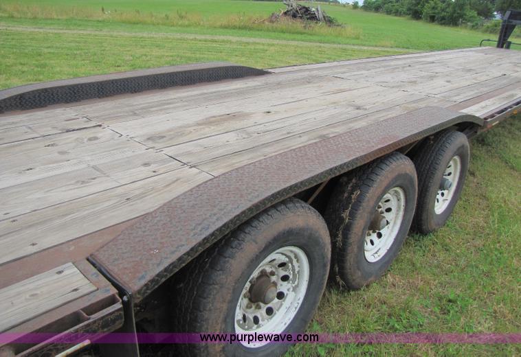 image for item A5096 2006 50' goose neck triple axle trailer