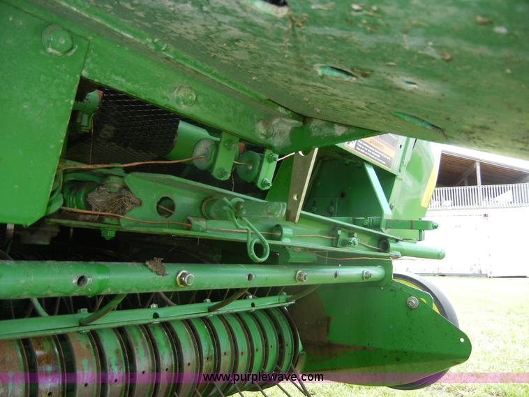 image for item A2111 2004 John Deere 567 round baler