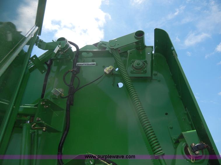 image for item A2111 2004 John Deere 567 round baler