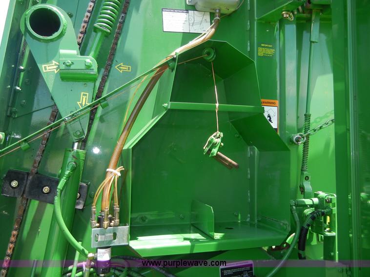 image for item A2111 2004 John Deere 567 round baler