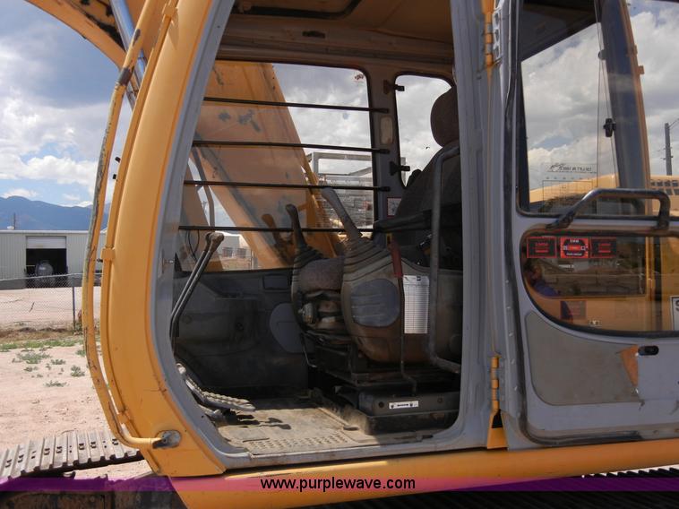 image for item A5399 1999 John Deere 120 excavator