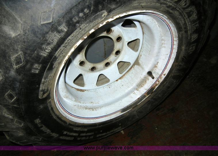 image for item A9784 (2) 12-16.5LT Goodyear tires on eight hole rims