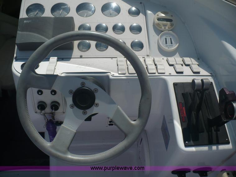 image for item A4851 1995 Baja 320 OS 32' boat and trailer