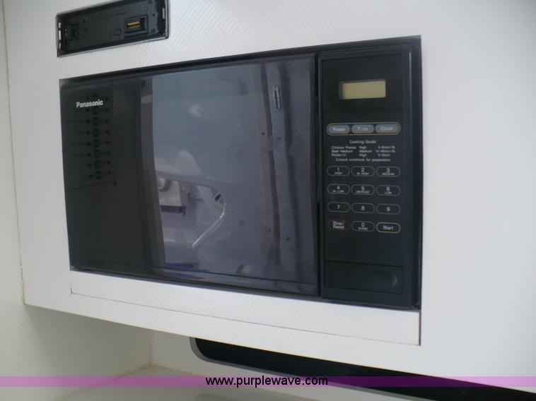 image for item A4851 1995 Baja 320 OS 32' boat and trailer