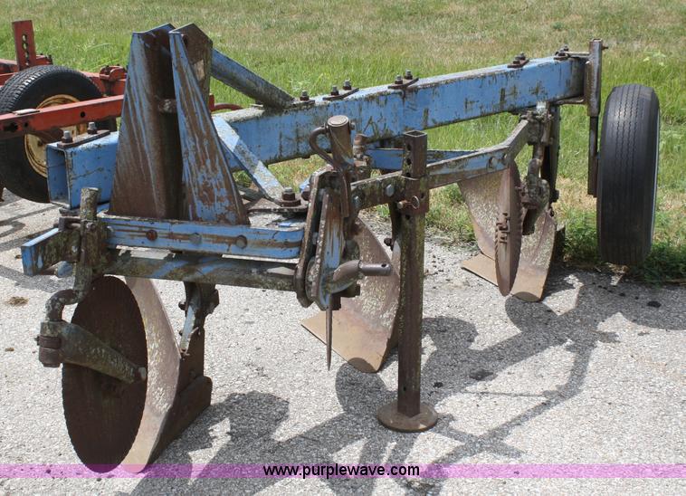 image for item A2211 Ford 142 three bottom plow