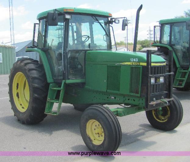 image for item A3663 2002 John Deere 6605 tractor