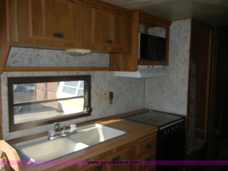image for item D9752 1986 Fleetwood Prowler 30' fifth wheel camper