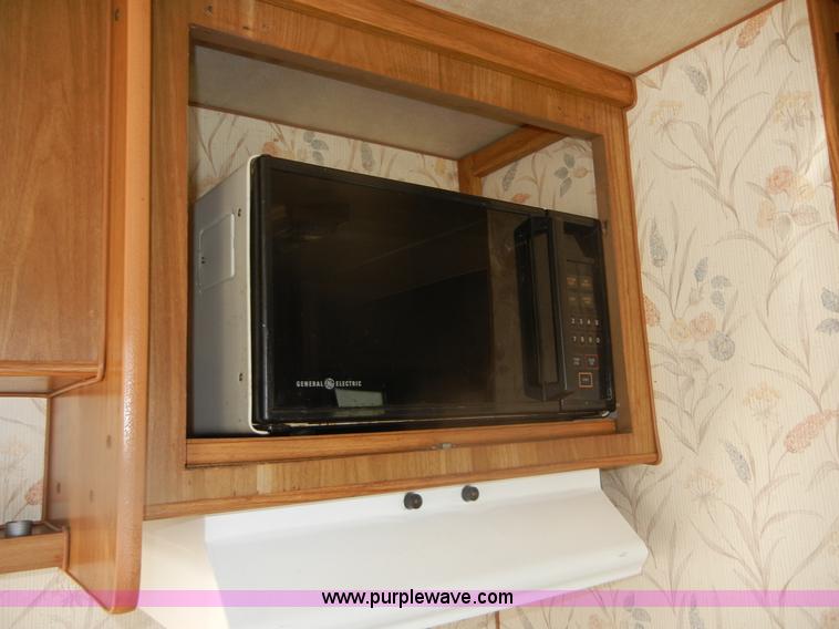 image for item D9752 1986 Fleetwood Prowler 30' fifth wheel camper