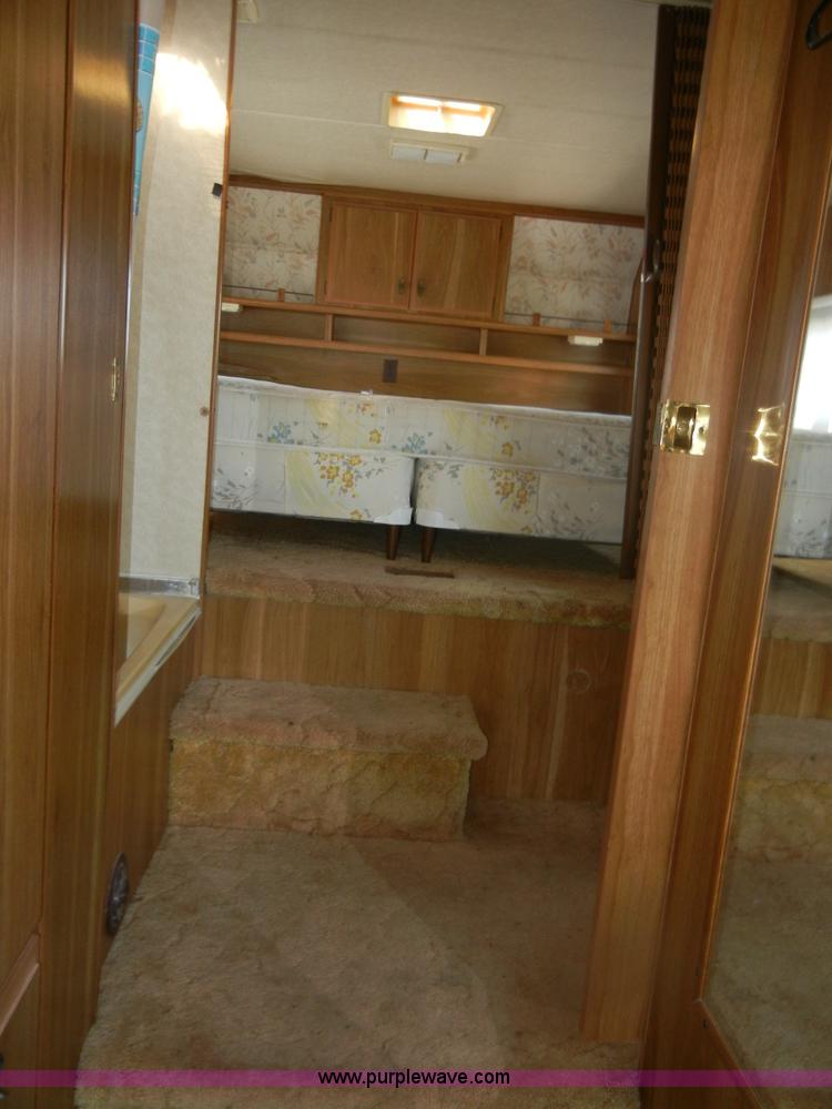 image for item D9752 1986 Fleetwood Prowler 30' fifth wheel camper