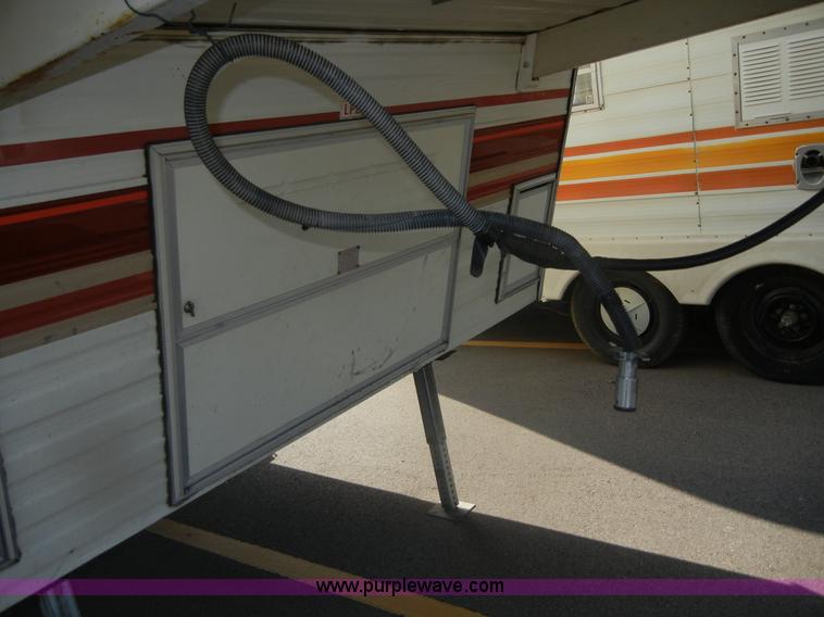 image for item D9752 1986 Fleetwood Prowler 30' fifth wheel camper