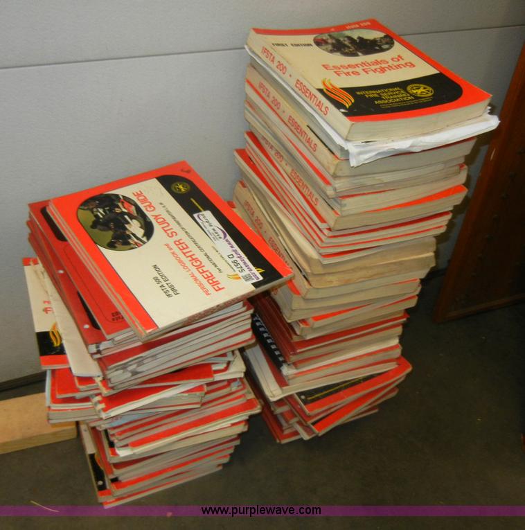 image for item D9575 Approximately 89 used fire fighter study guides and first aid guides