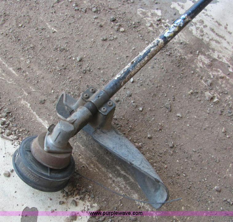 image for item F9820 John Deere XT1708 weed eater