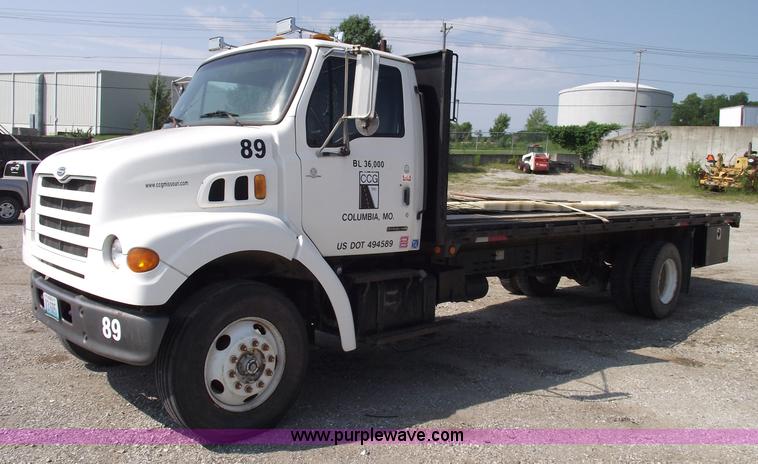 image for item A4034 1999 Sterling L7501 flatbed truck