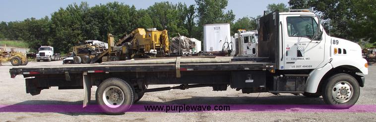 image for item A4034 1999 Sterling L7501 flatbed truck