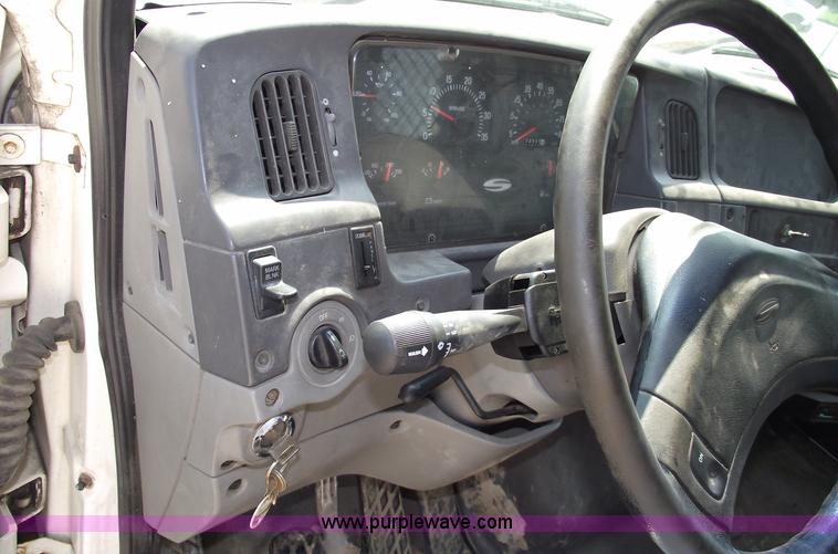 image for item A4034 1999 Sterling L7501 flatbed truck