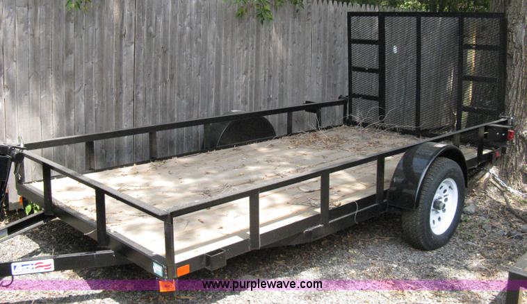 image for item A4316 2011 Liberty flatbed trailer