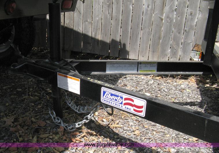 image for item A4316 2011 Liberty flatbed trailer