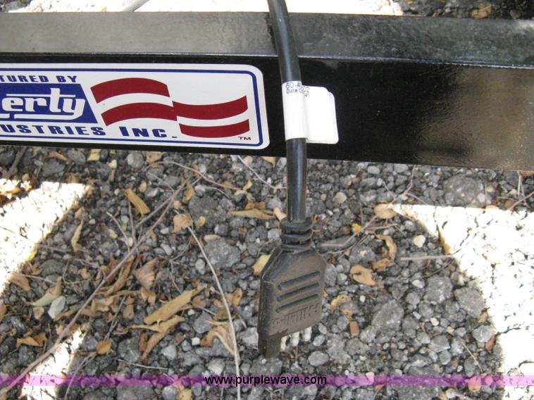 image for item A4316 2011 Liberty flatbed trailer