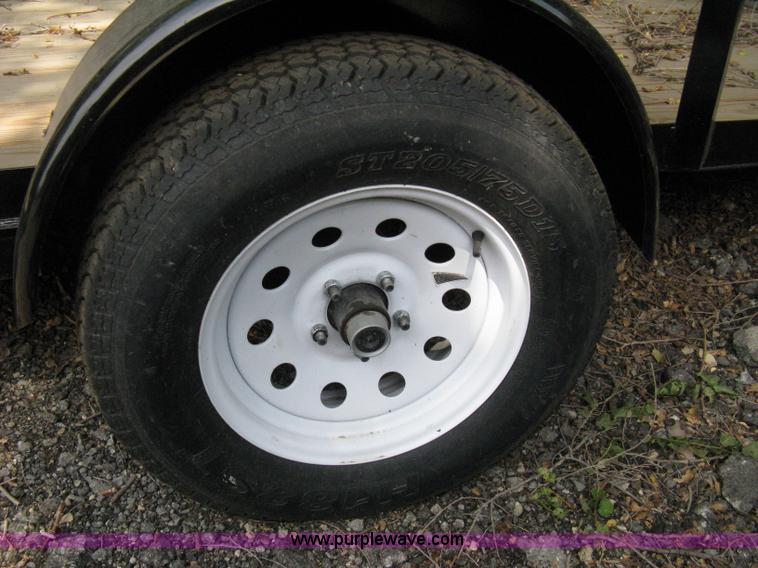 image for item A4316 2011 Liberty flatbed trailer