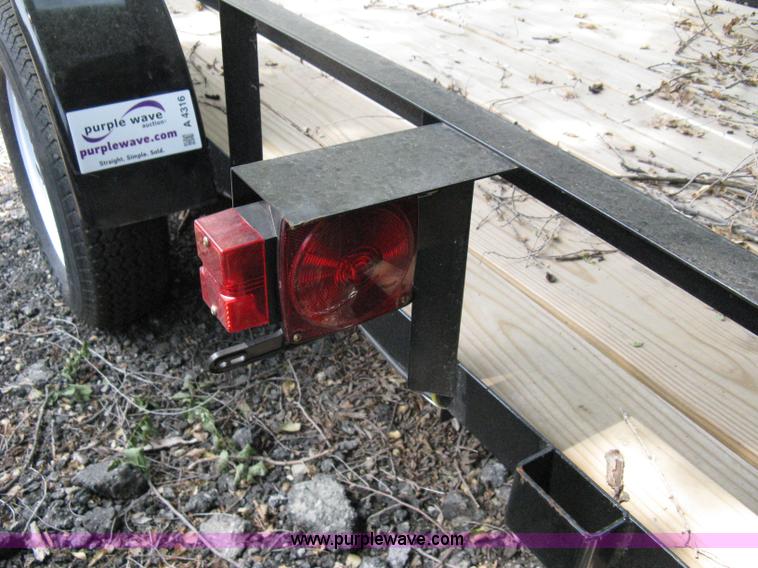 image for item A4316 2011 Liberty flatbed trailer