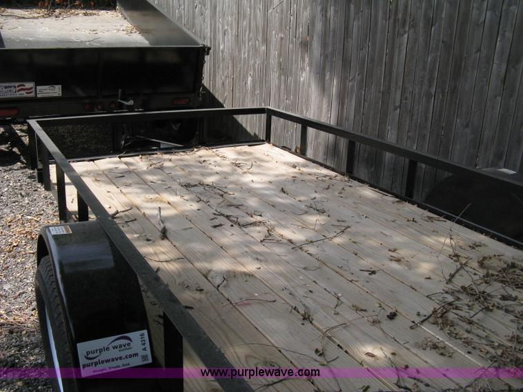 image for item A4316 2011 Liberty flatbed trailer