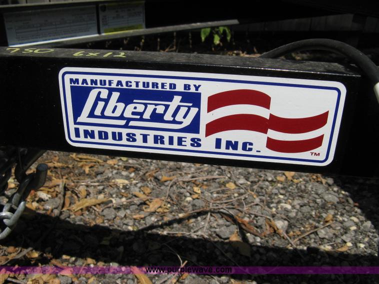image for item A4316 2011 Liberty flatbed trailer