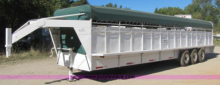 image for item A5043 1983 neck-over triple axle stock trailer