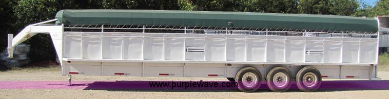 image for item A5043 1983 neck-over triple axle stock trailer