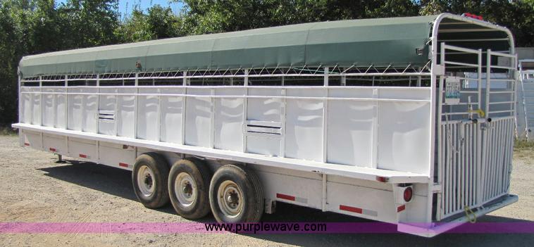 image for item A5043 1983 neck-over triple axle stock trailer