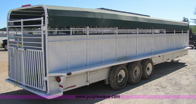 image for item A5043 1983 neck-over triple axle stock trailer