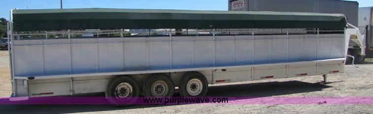 image for item A5043 1983 neck-over triple axle stock trailer