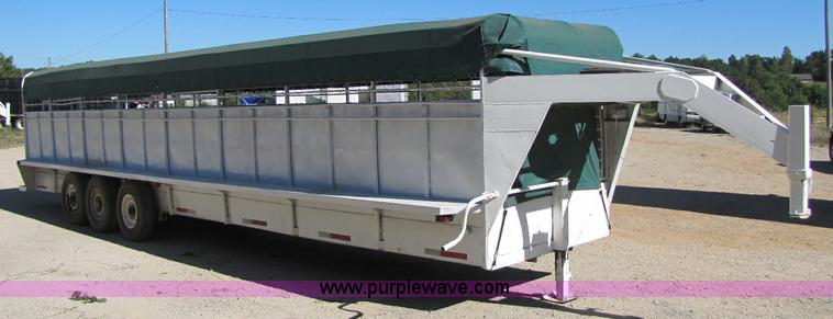 image for item A5043 1983 neck-over triple axle stock trailer