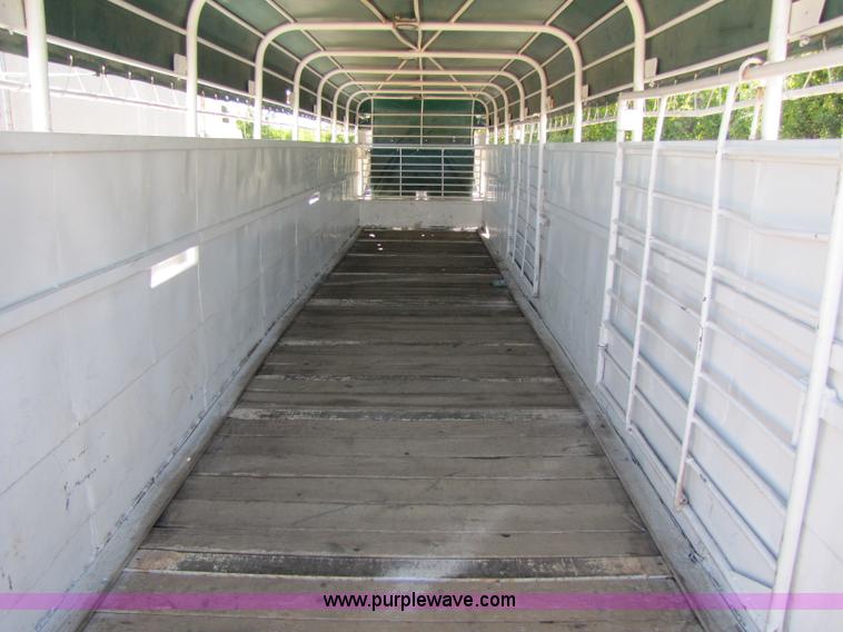 image for item A5043 1983 neck-over triple axle stock trailer