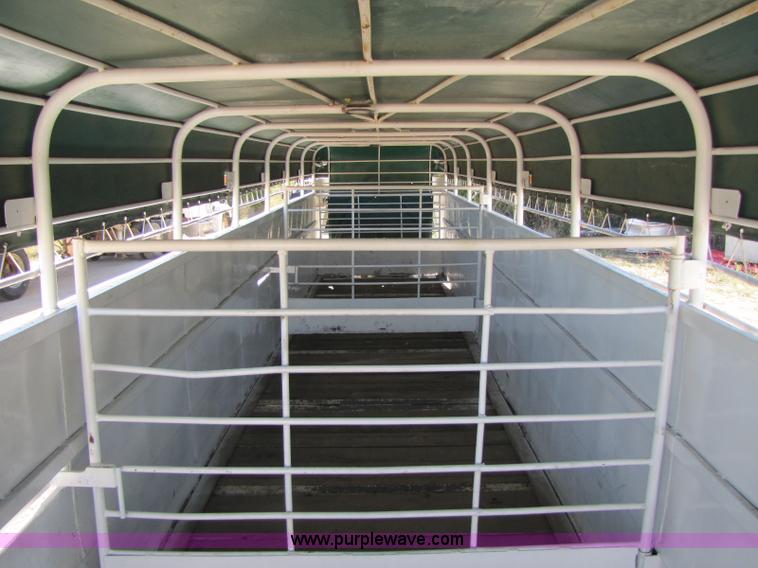 image for item A5043 1983 neck-over triple axle stock trailer