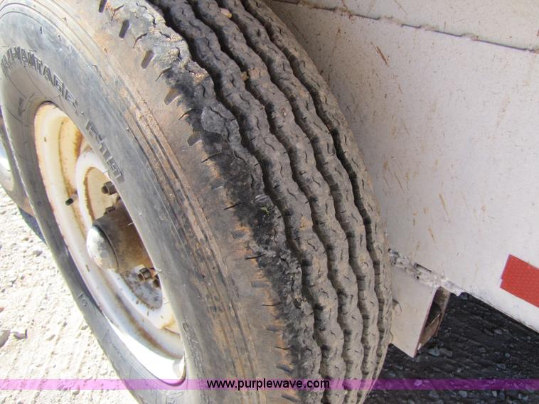 image for item A5043 1983 neck-over triple axle stock trailer