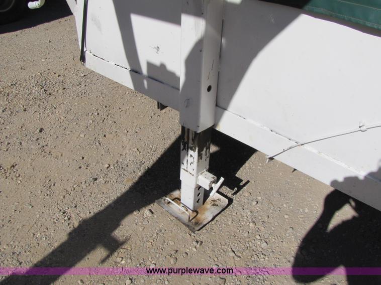 image for item A5043 1983 neck-over triple axle stock trailer