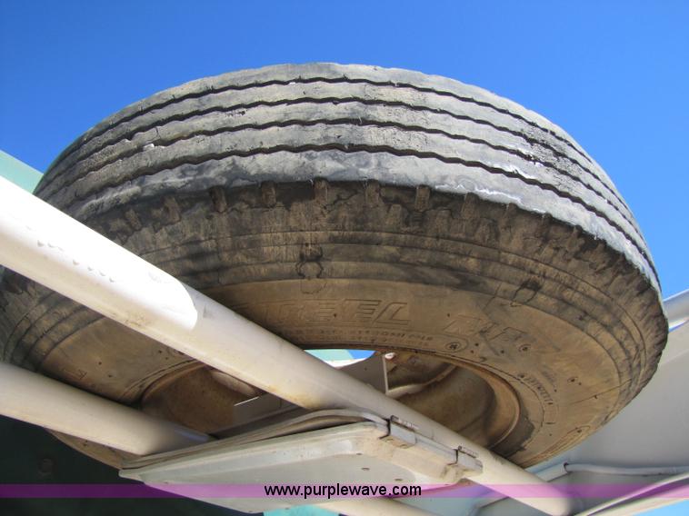 image for item A5043 1983 neck-over triple axle stock trailer