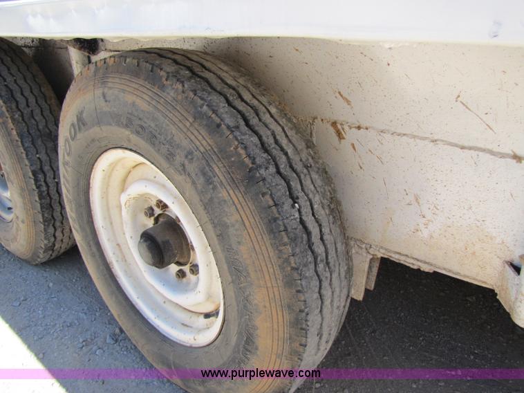 image for item A5043 1983 neck-over triple axle stock trailer