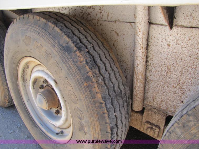 image for item A5043 1983 neck-over triple axle stock trailer