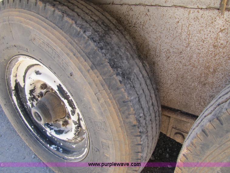 image for item A5043 1983 neck-over triple axle stock trailer