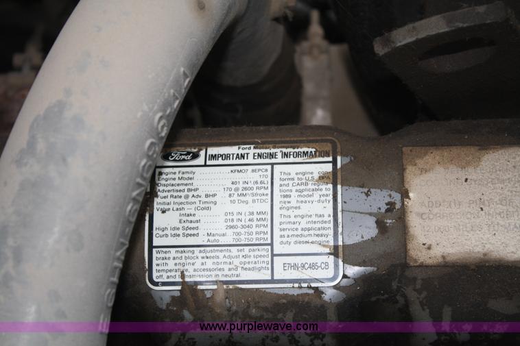 image for item A2337 1989 Ford F700 flatbed truck