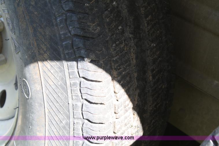 image for item A2375 2004 Norstar Cimarron three horse slant trailer