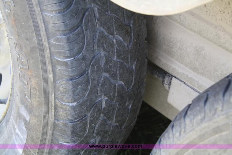 image for item A2375 2004 Norstar Cimarron three horse slant trailer