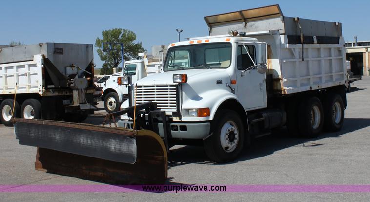 image for item A2891 1999 International 4900 tandem axle dump truck with plow and spreader