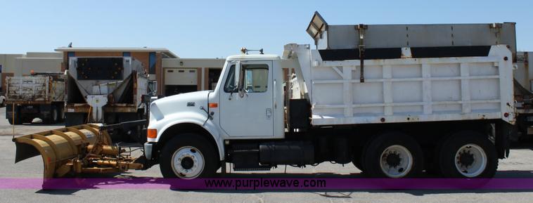 image for item A2891 1999 International 4900 tandem axle dump truck with plow and spreader