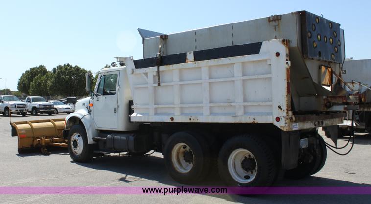 image for item A2891 1999 International 4900 tandem axle dump truck with plow and spreader