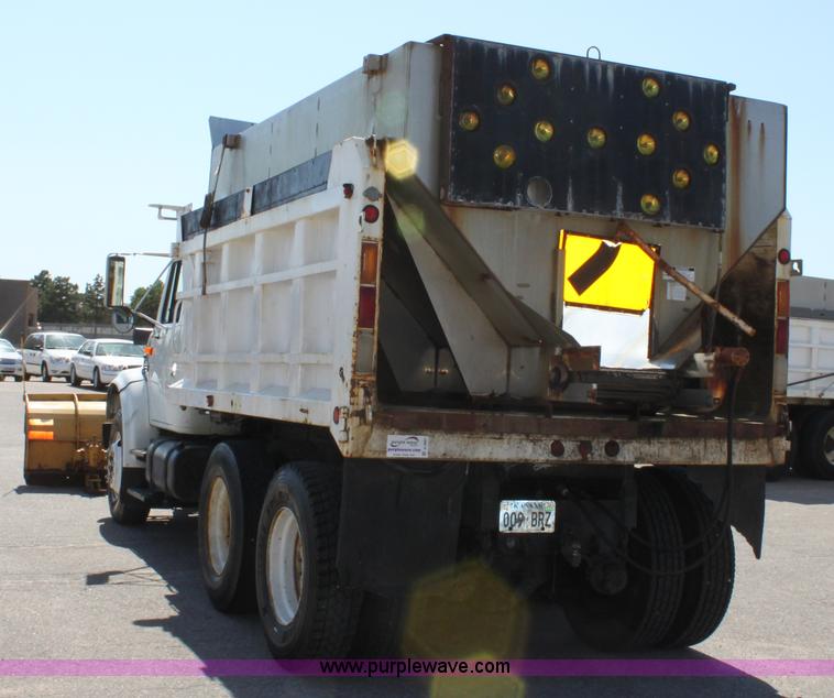 image for item A2891 1999 International 4900 tandem axle dump truck with plow and spreader